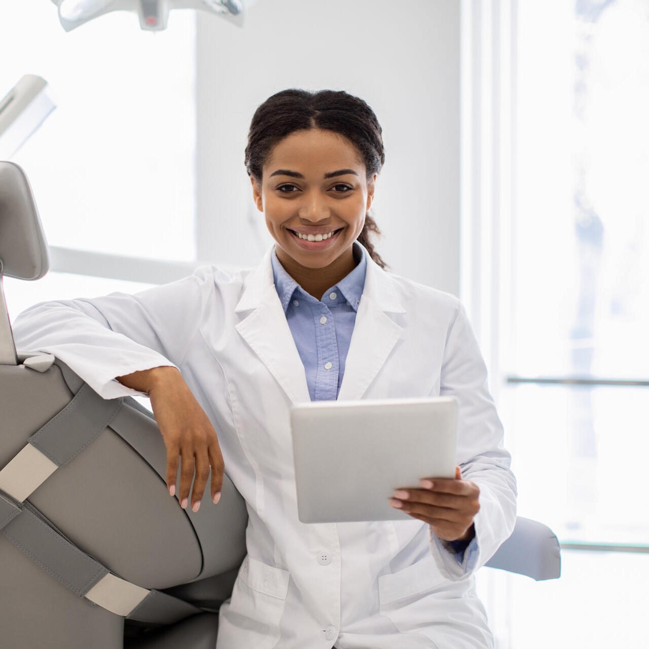 happy-black-dentist-female-with-digital-tablet-pos-2025-03-18-18-36-12-utc-e1753428327822.jpg